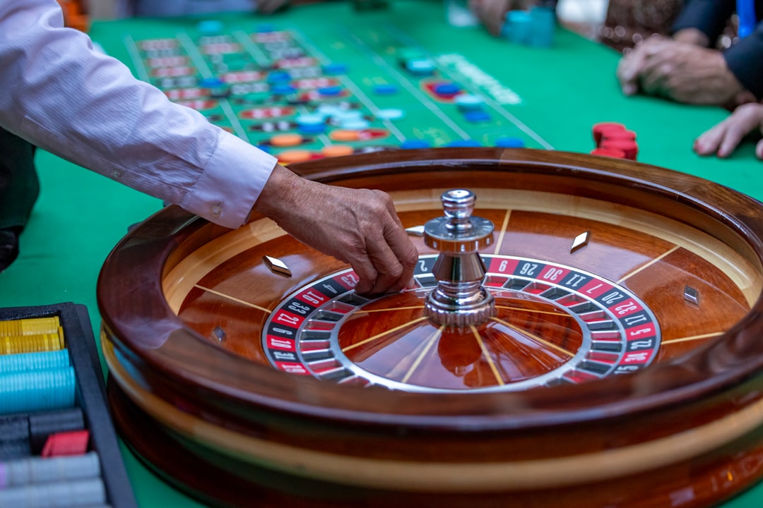 a-man-is-playing-a-game-of-roule-on-a-green-table-9f-qhniqxqc